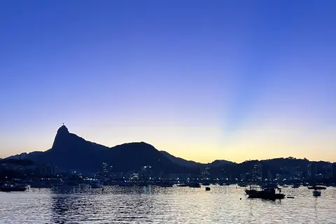 Corcovado silhouette over the bay at blue hour, seen from Urca