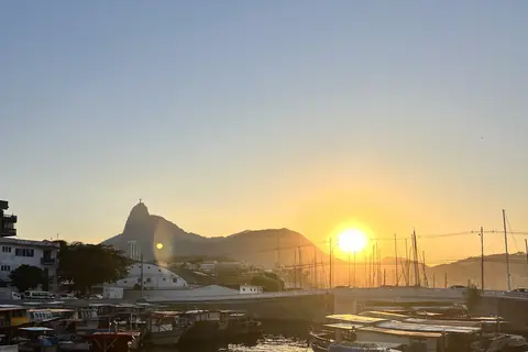 Sunset over the small harbor in Urca with Corcovado in the distance